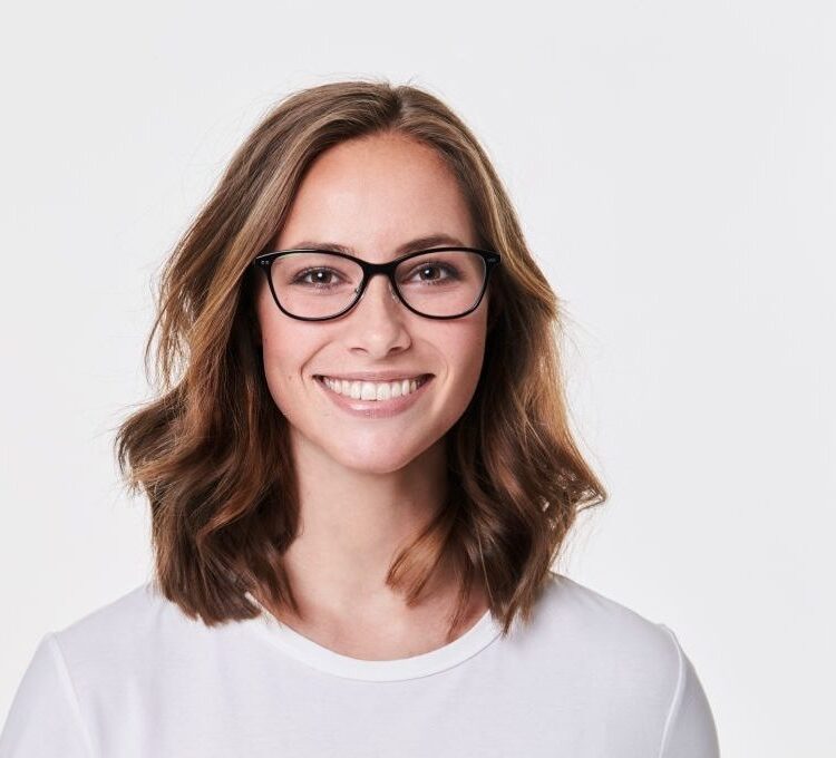 Glasses girl in white t-shirt, smiling